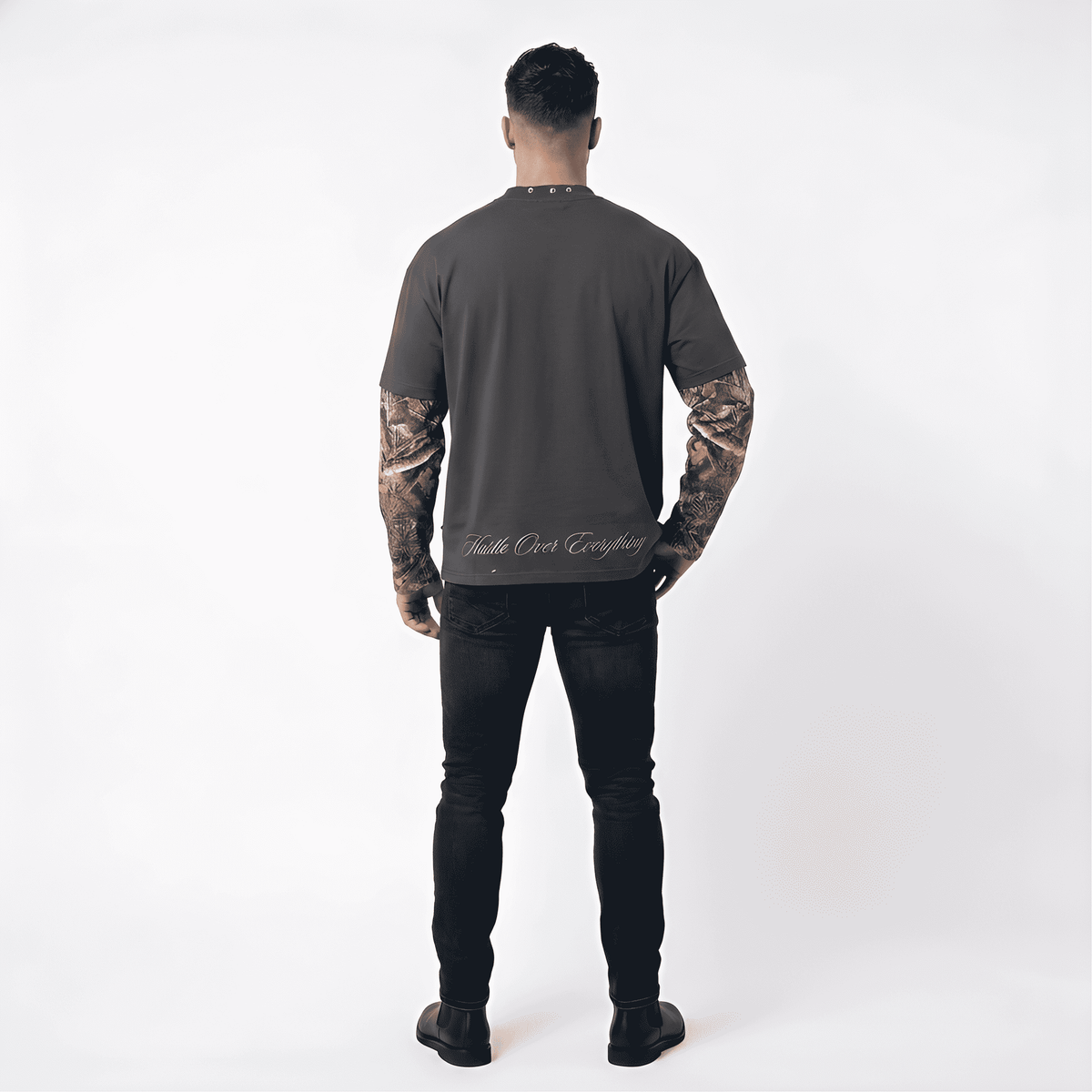 Dark grey JEVPE men's long sleeve T-shirt with gothic Jesus graphic, cross chain print, and studded neckline, streetwear style.