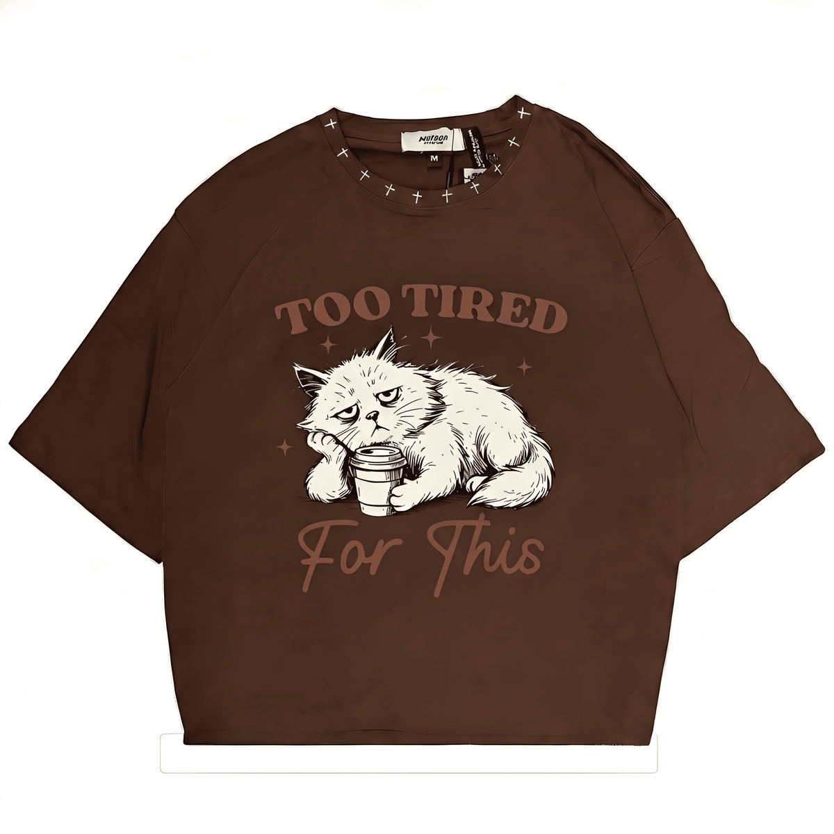 Brown oversized T-shirt featuring Grumpy Cat graphic with "Too Tired For This" text, streetwear style from JEVPE.