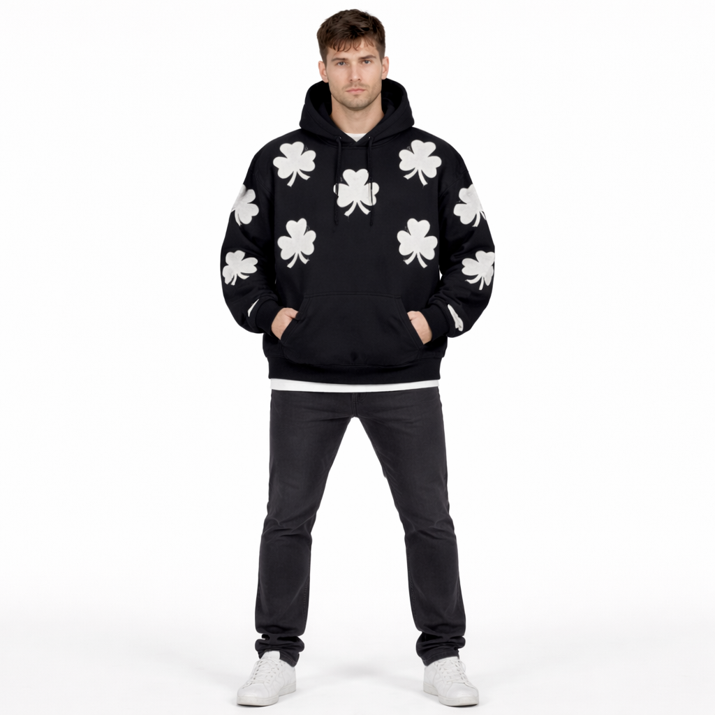 Black oversized hoodie for men by JEVPE featuring vintage streetwear style with a bold clover graphic on the front.