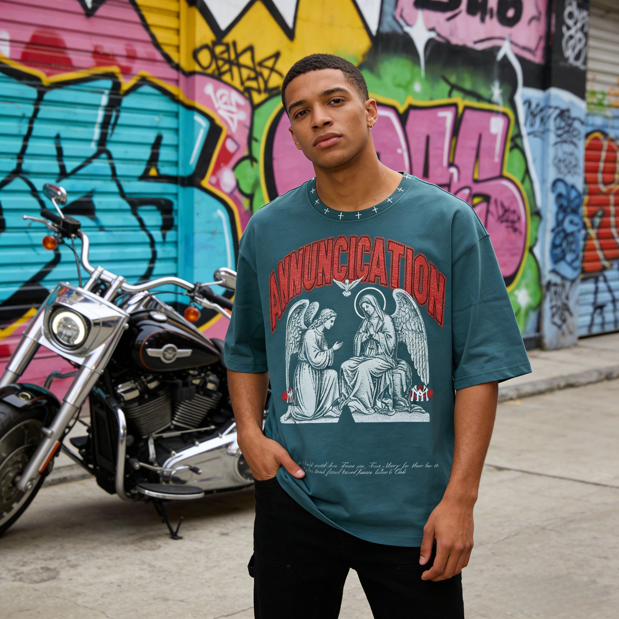 JEVPE Sacred Annunciation Angel print teal oversized cropped streetwear tee, featuring angel artwork on front.