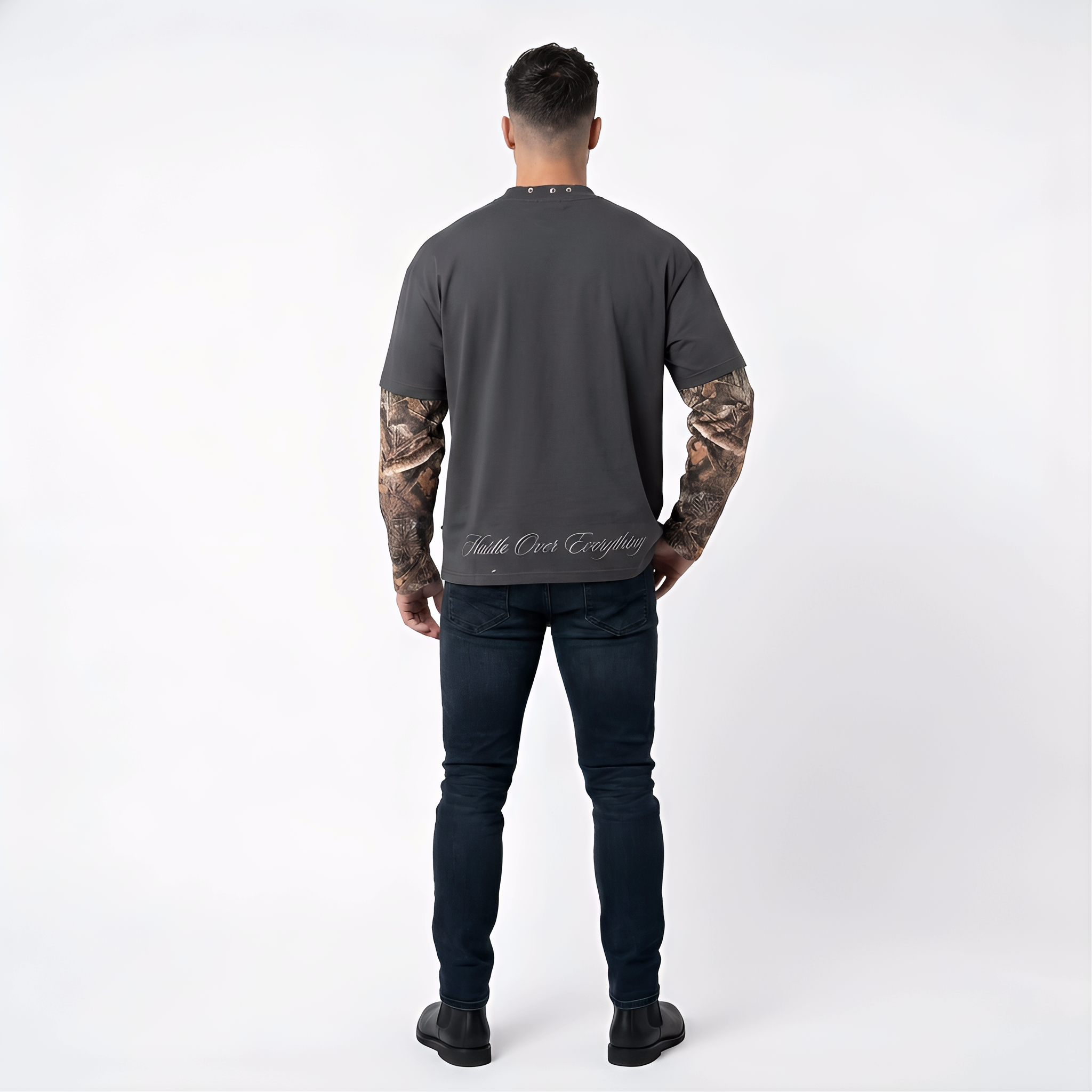 Dark grey JEVPE men's long sleeve T-shirt with gothic Jesus graphic, cross chain print, and studded neckline, streetwear style.