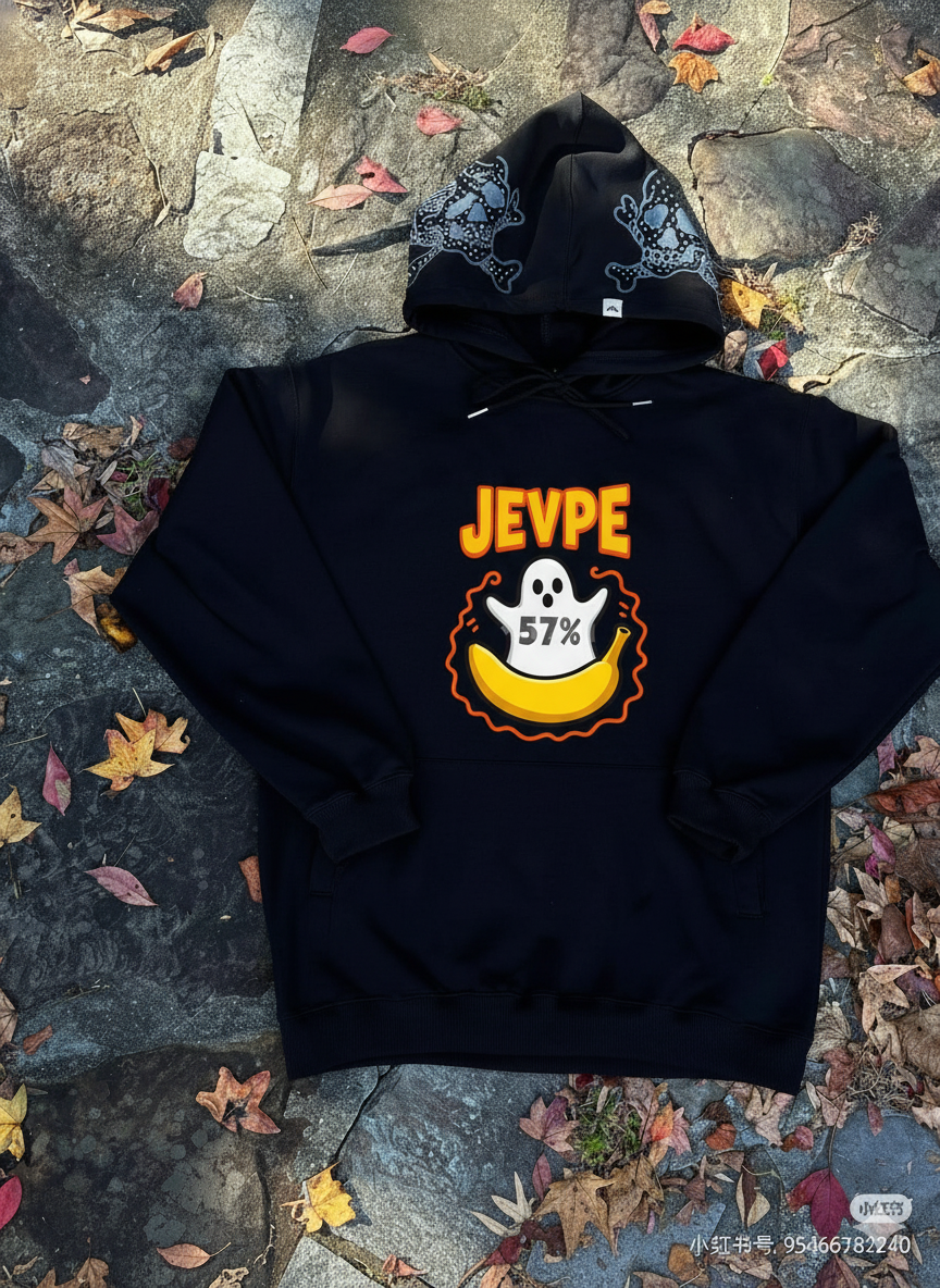 Black oversized Halloween hoodie by JEVPE featuring a ghost and banana graphic design on the front.